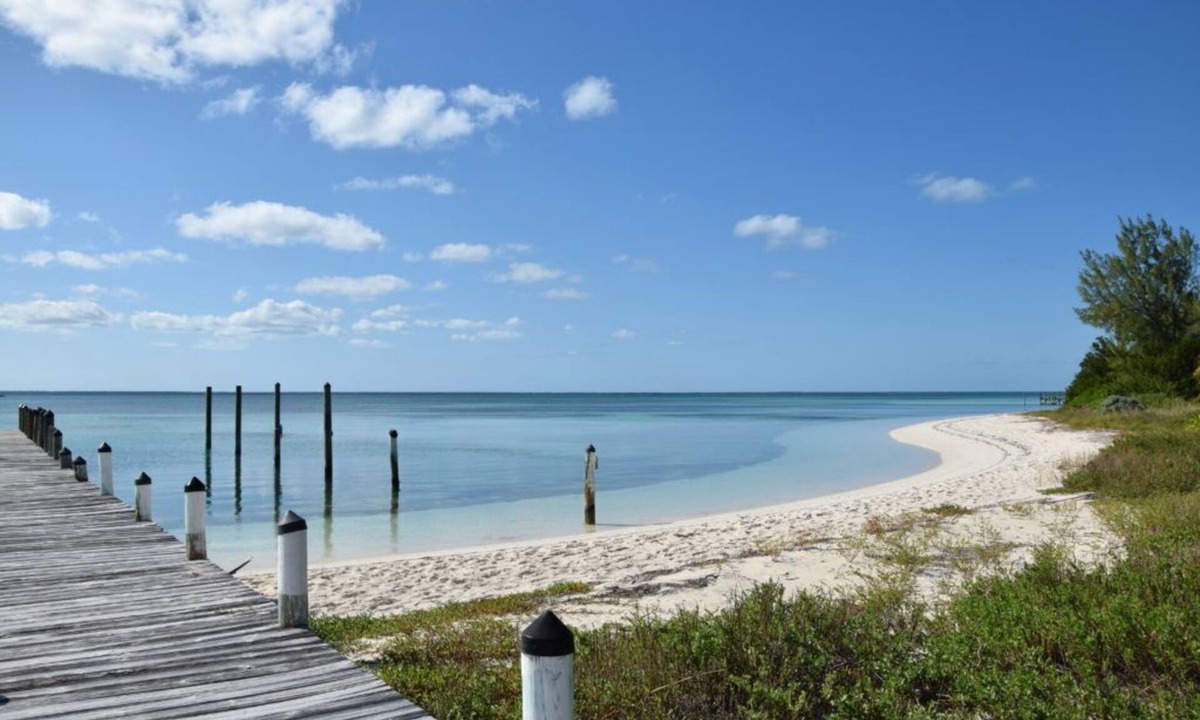 Green Turtle Cay Cottage | Adorable Pink cottage-OCEAN FRONT on Coco Bay with a dock. 15% SUMMER DISCOUNT!