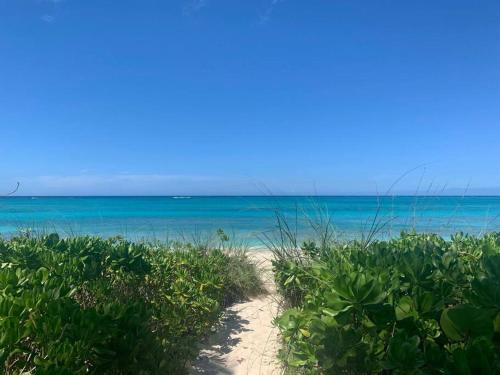 Westwind Apartment | Beach'nBarefoot (Love Beach) - nestled on the beach