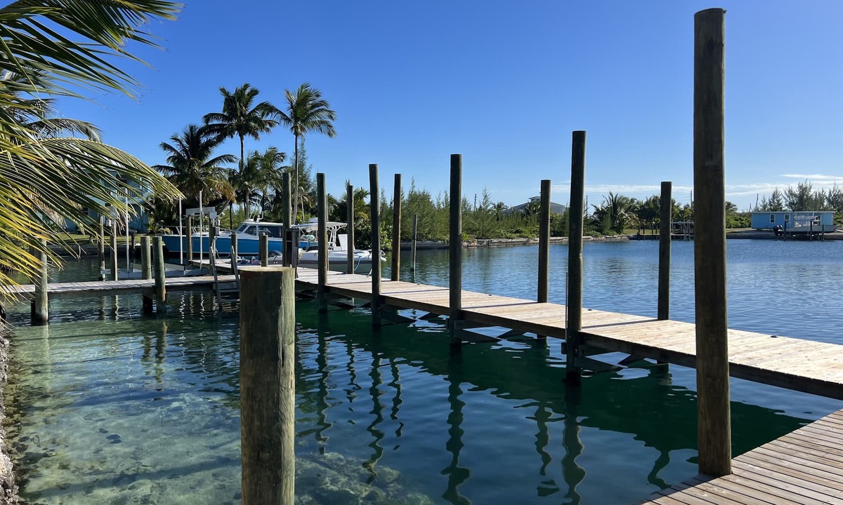 Treasure Cay House | Big Yellow House with Deep Water Dock with Power, and Tesla Backup Power.