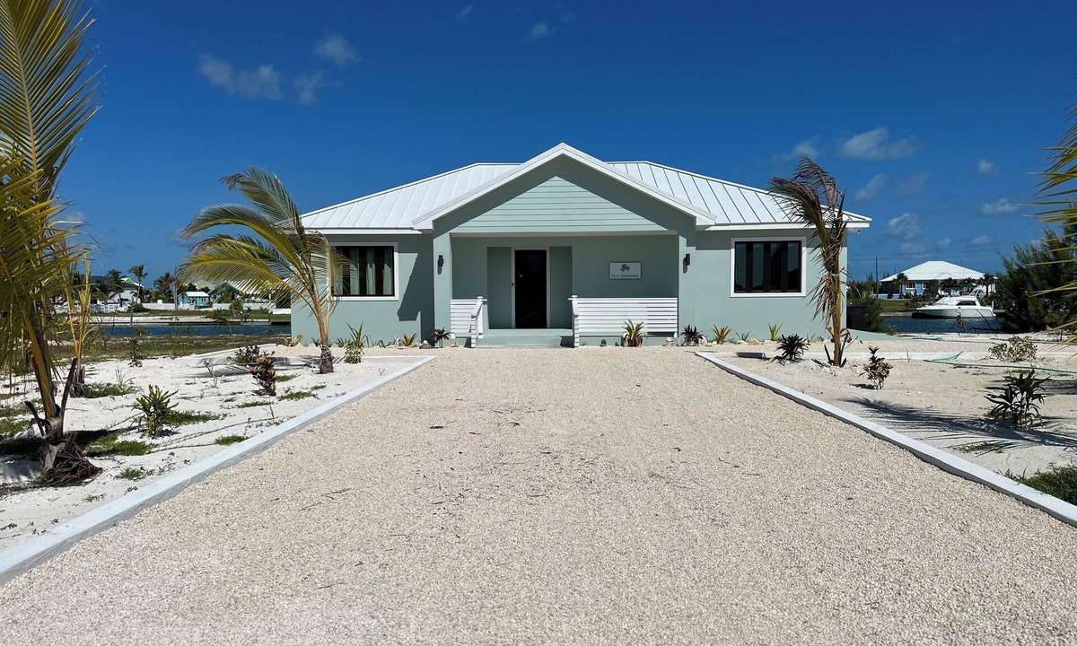 Treasure Cay House | Deep water Canal front home w/dock across the street from the beach.