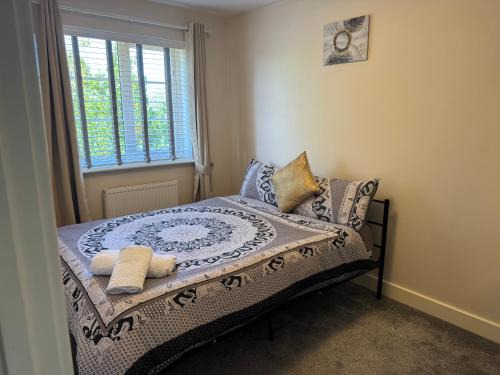 Milton Malsor House | Double bedroom in a residential home with parking