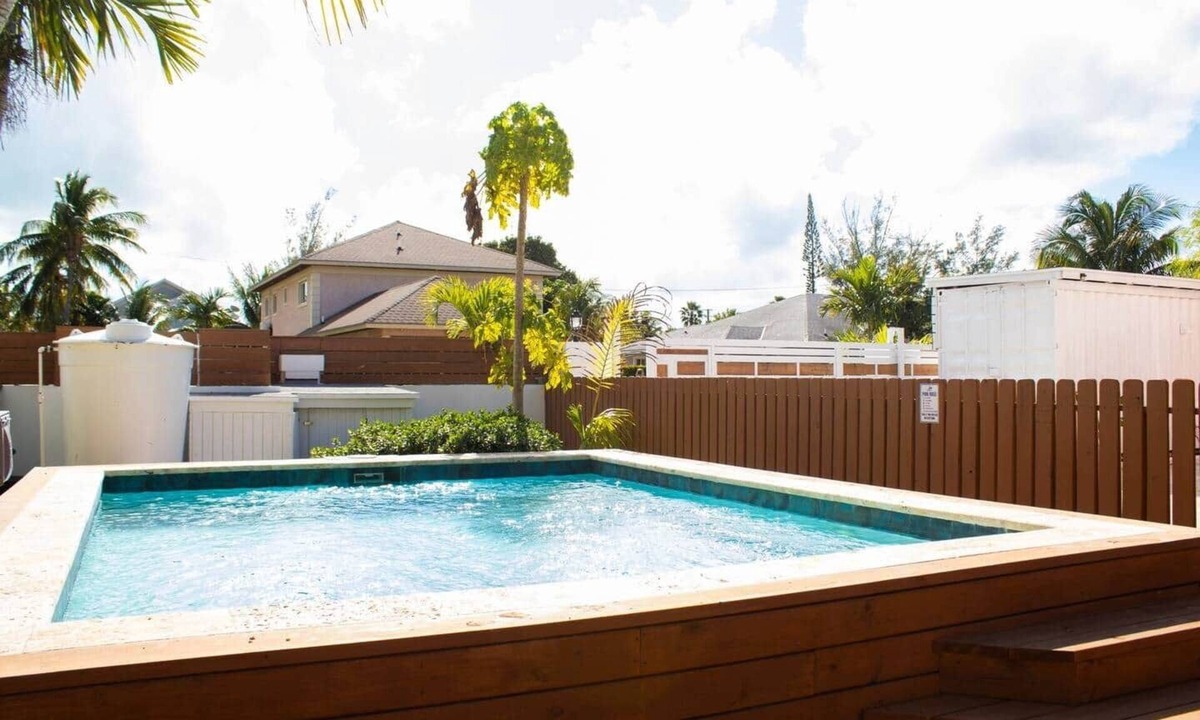 Coral Harbour Apartment | Tangerine Sunsets Pink Marlin