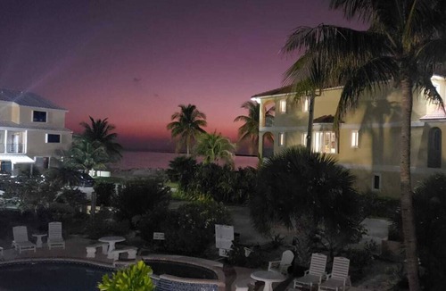 Bahamas Terrace Condo | 2-bedroom condo in oceanfront complex in Freeport with pool, WiFi, beach chairs.