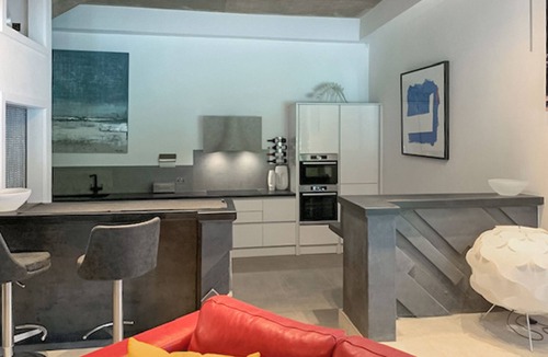 Tan-y-groes Apartment | A concrete themed one bedroom apartment.