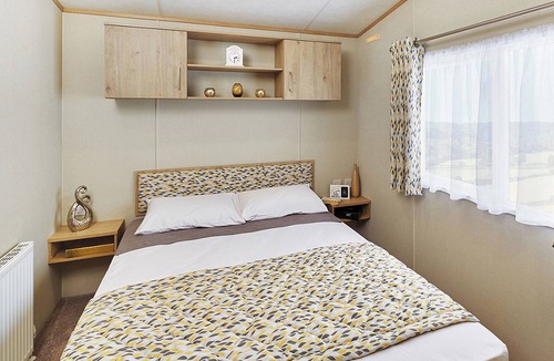 Cresswell House | A modern holiday home with one master double and two twin bedrooms.