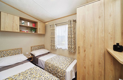 Cresswell House | A modern holiday home with one master double and two twin bedrooms.