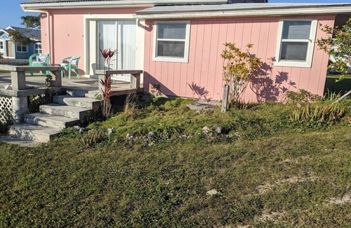 Green Turtle Cay Cottage | Adorable Pink cottage-OCEAN FRONT on Coco Bay with a dock. 15% SUMMER DISCOUNT!