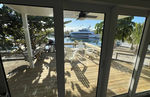 Treasure Cay House | Big Yellow House with Deep Water Dock with Power, and Tesla Backup Power.