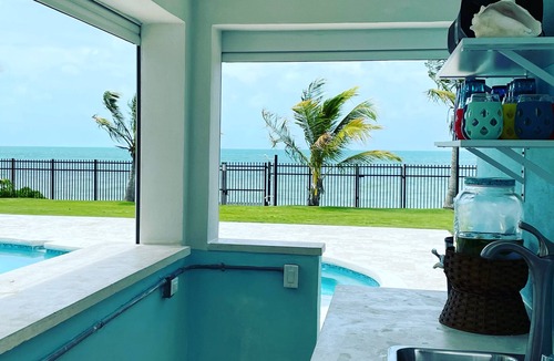 Coral Harbour House | Blue Birds Beach House, comfortable beach readaway with a heated pool