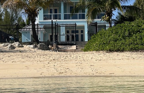 Coral Harbour House | Blue Birds Beach House, comfortable beach readaway with a heated pool