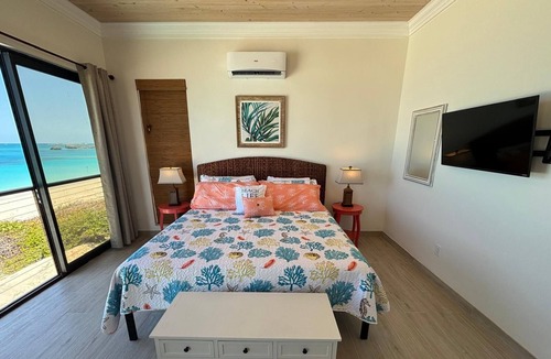 Farmer's Hill Villa | BRAND NEW! Breathtaking Beachfront Palm Grove Villa: Beach, Pool, Spa, Palms!