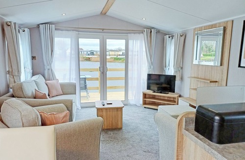 Ryther House | Comfortable caravan with one double with en suite shower room, and one twin.