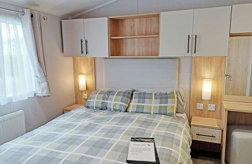 Ryther House | Comfortable caravan with one double with en suite shower room, and one twin.