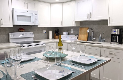 Williams Town Condo | Coral Beach Private Modern Beachfront Condo