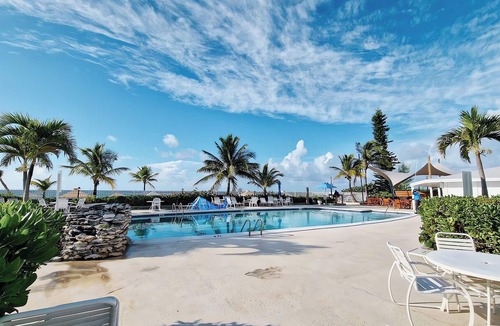 Williams Town Condo | Coral Beach Private Modern Beachfront Condo