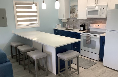 Bahama Reef Apartment | Cozy private green studio cottage on water free floating dock at your doorstep