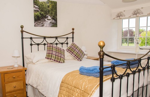 Exford House | Crown Cottage is a picture postcard thatched, self catering holiday cottage