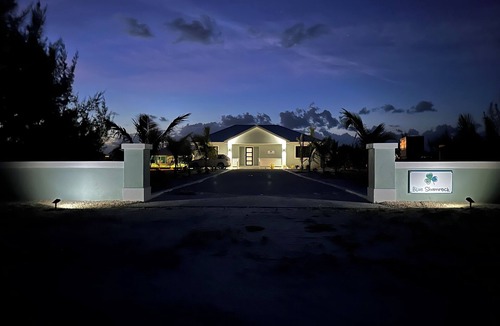 Treasure Cay House | Deep water Canal front home w/dock across the street from the beach.