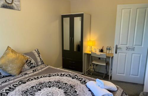 Milton Malsor House | Double bedroom in a residential home with parking