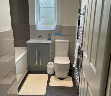 Milton Malsor House | Double bedroom in a residential home with parking