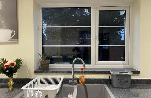 Milton Malsor House | Double bedroom in a residential home with parking