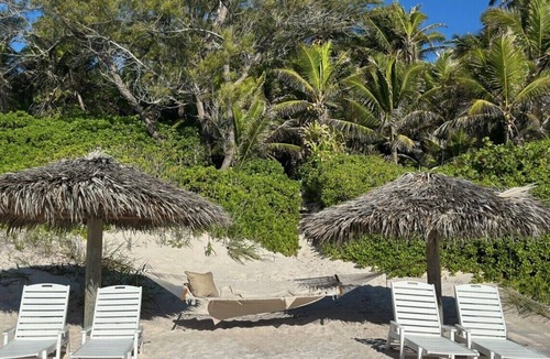 Dunmore Town House | Elegant Garden Oasis, Private Path to Harbour Island's Legendary Pink Sands