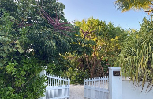Dunmore Town House | Elegant Garden Oasis, Private Path to Harbour Island's Legendary Pink Sands