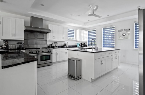 Palm Cay Villa | Exclusive Luxury Beachfront Villa - Private White Sand Beach, Upscale amenities.