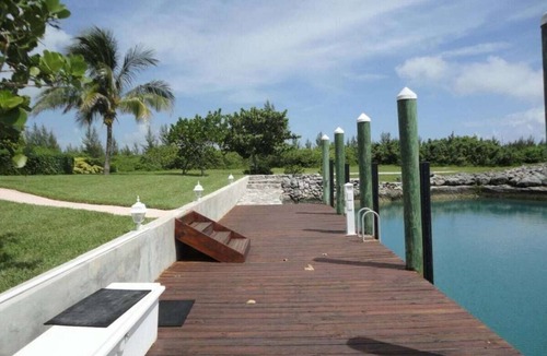 West End House | Green House With Dock in West End Bahamas Old Bahama Day