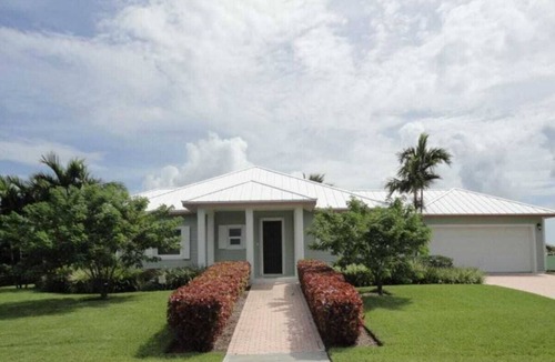 West End House | Green House With Dock in West End Bahamas Old Bahama Day