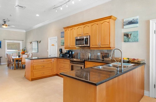Rokers Point House | Hart House, vast patio with hot tub, heated pool & outdoor bar on Flamingo Bay