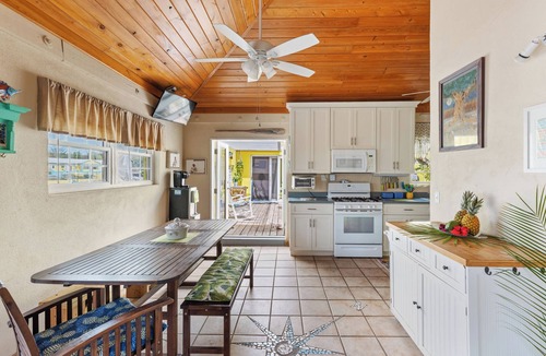 Gregory Town Villa | Home overlooking Gregory Town's famous Cove. Beach chairs and SUP included