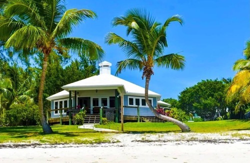 Hope Town House | Hope Town's Top Rental: Beachfront sunsets, AC, free boat dock, & close to town!