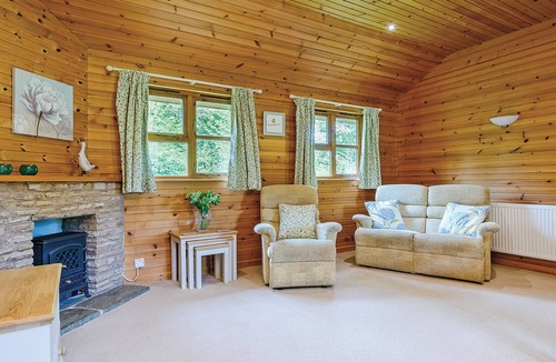 Kilcot Ski Chalet | Lodge with one king-size double with en suite bathroom with shower.