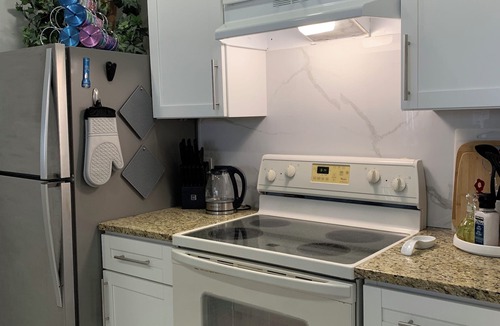Williams Town Condo | Luxurious Beachfront Condo with Breath Taking Ocean, Beach and Garden Views.