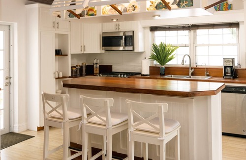 Dunmore Town House | Luxury Island Beach House with Private Pool Oasis