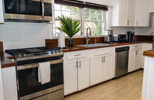 Dunmore Town House | Luxury Island Beach House with Private Pool Oasis