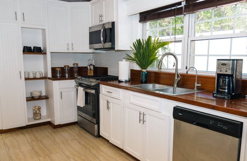 Dunmore Town House | Luxury Island Beach House with Private Pool Oasis