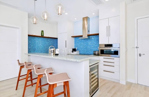 Downtown Nassau Apartment | Margaritaville Waterpark Three Bedroom Residence with Kitchen and Balcony.