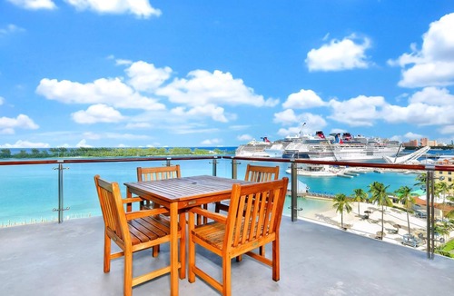 Downtown Nassau Apartment | Margaritaville Waterpark Three Bedroom Residence with Kitchen and Balcony.