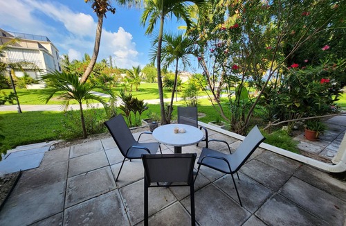 Williams Town Condo | NEW Stunning Ground Floor Beachfront Studio in Coral Beach, Grand Bahamas