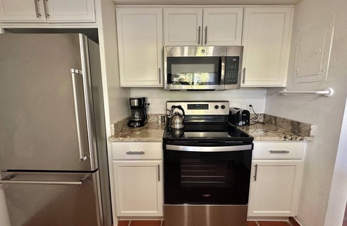 Williams Town Condo | Palm Tree Cove - Stunning Partial Ocean Views; Beachfront Location!