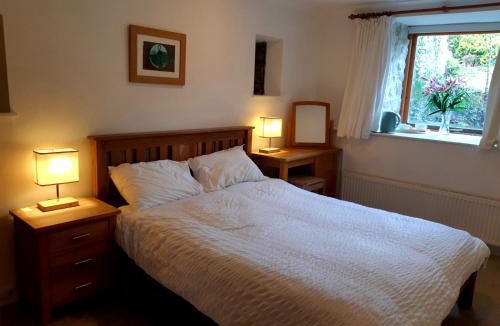 Tewitfield House | Plough Cottage is a 18th Century barn conversion offering a tranquil rural retreat 9 miles from the Lake District National Park