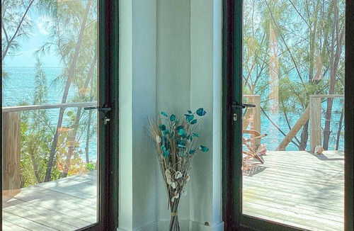 Rainbow Bay House | Remodeled Oceanfront Cottage Directly on the Warm Calm Caribbean