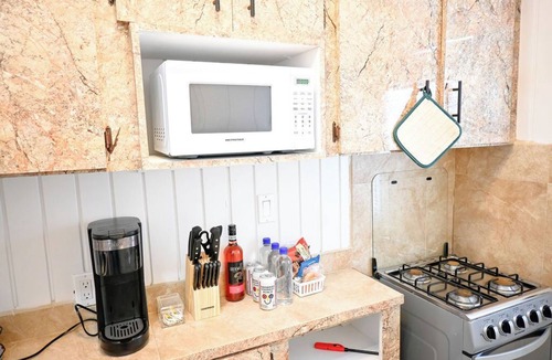 Rock Sound Apartment | Rock Sound 2BR |Snacks, A/C + Walk to Eats