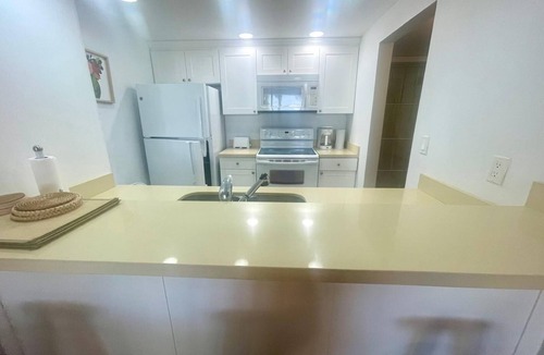Williams Town Condo | Sandy Beach within minutes from your private garden patio