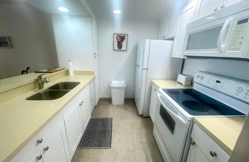 Williams Town Condo | Sandy Beach within minutes from your private garden patio