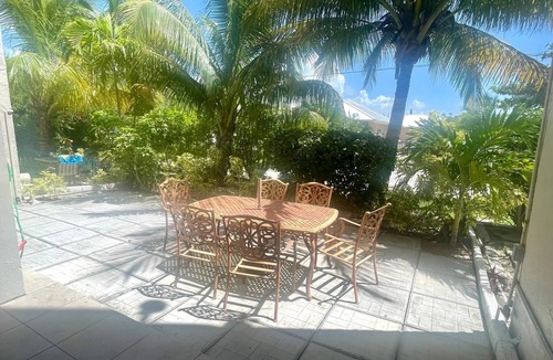 Williams Town Condo | Sandy Beach within minutes from your private garden patio