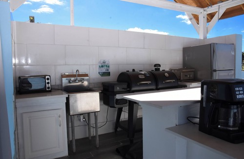 Westwind Bed & Breakfast | Secure 2-bedroom retreat, outdoor kitchen & saltwater pool oasis. Beach nearby
