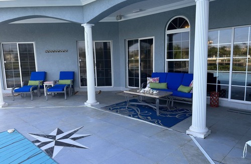 Bahamia West House | Stunning Freeport Grand Bahama Villa on Canal, with Infinity Pool & 40 ft dock